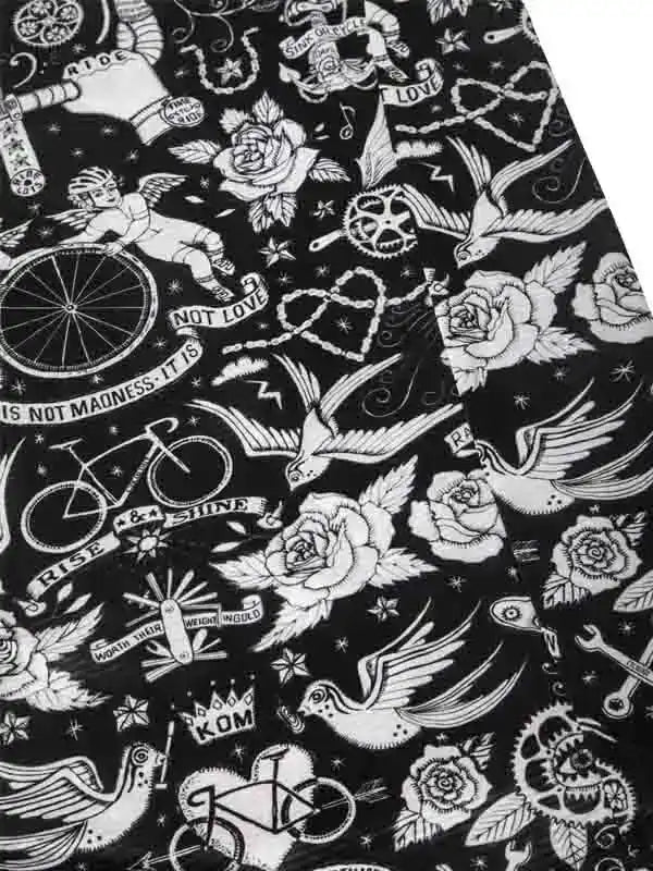 Black and white cycling-themed fabric with roses, birds, bikes, and tattoo-style designs for men's and women's apparel