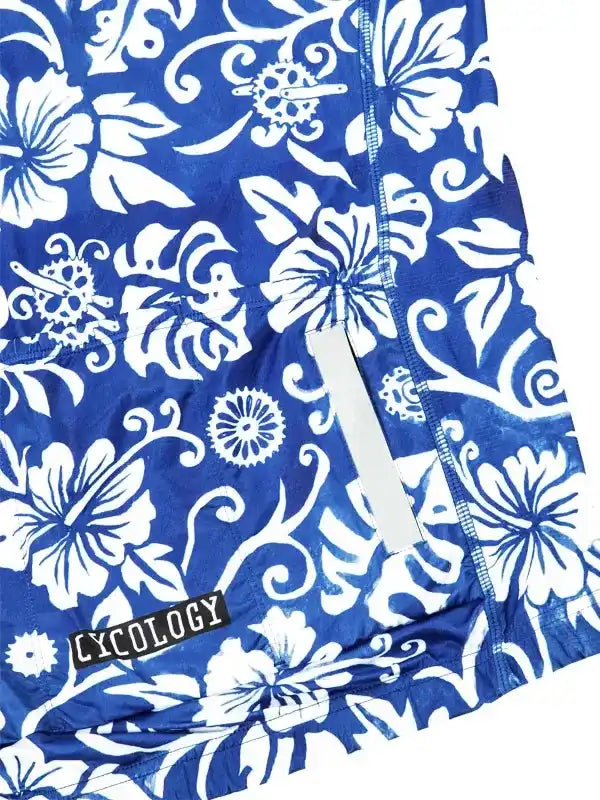 Blue cycling jersey with white floral and gear pattern, featuring reflective strip and 'CYCOLOGY' tag