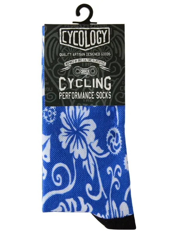 Blue floral cycling performance socks with white pattern, artisan designed for bike culture