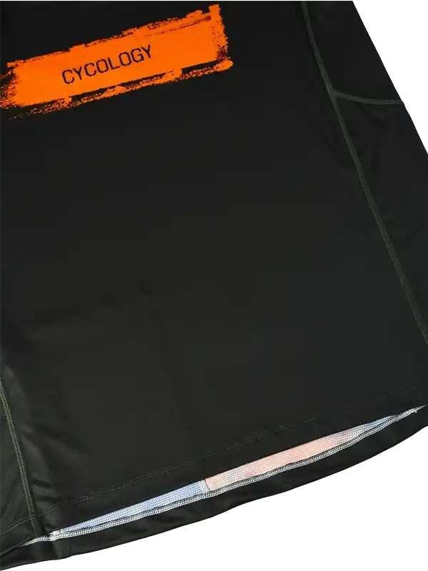 Black cycling jersey with orange Cycology logo, featuring breathable fabric and reflective trim for safety.