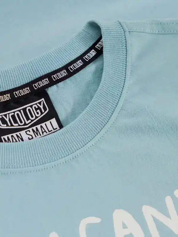 Light blue men's cycling tee with branded neck tag, soft fabric, small size label