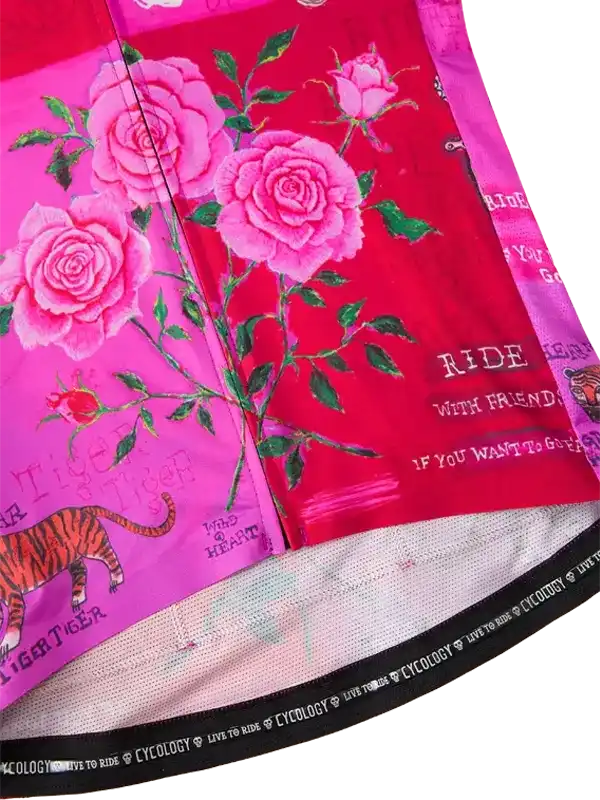 Vibrant pink cycling jersey with rose and tiger print, featuring 'Ride With Friends' text and breathable fabric.