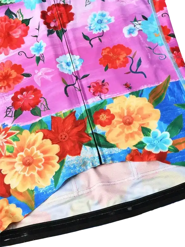 Vibrant floral cycling shorts with pink, blue, and orange blooms on performance fabric