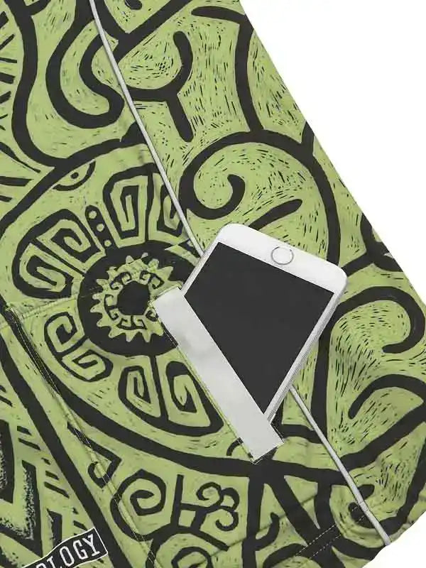 Green cycling shorts with black abstract pattern and phone pocket, ideal for men's or women's rides