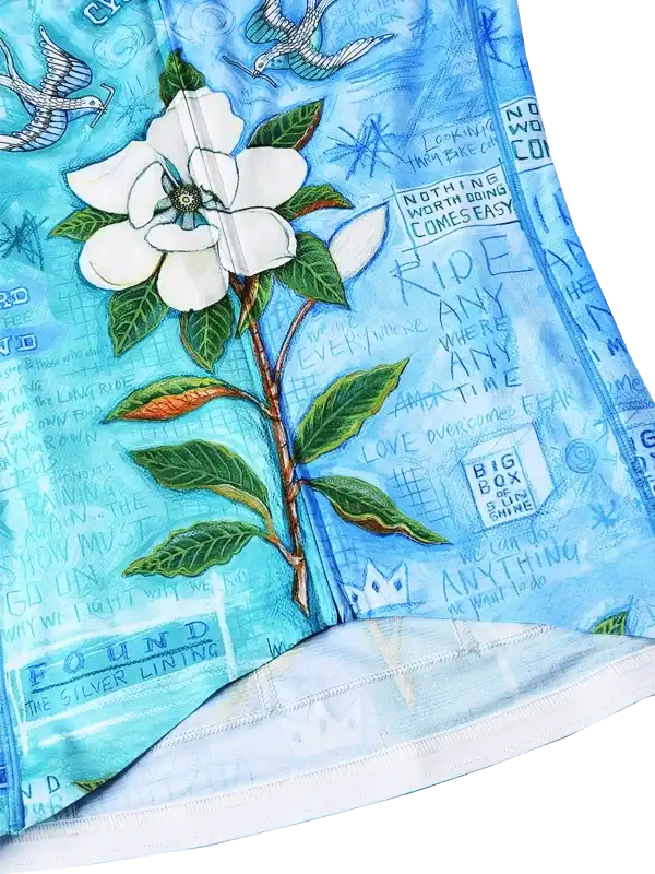 Blue cycling jersey with white flower print, motivational quotes, and bird design for men's or women's rides