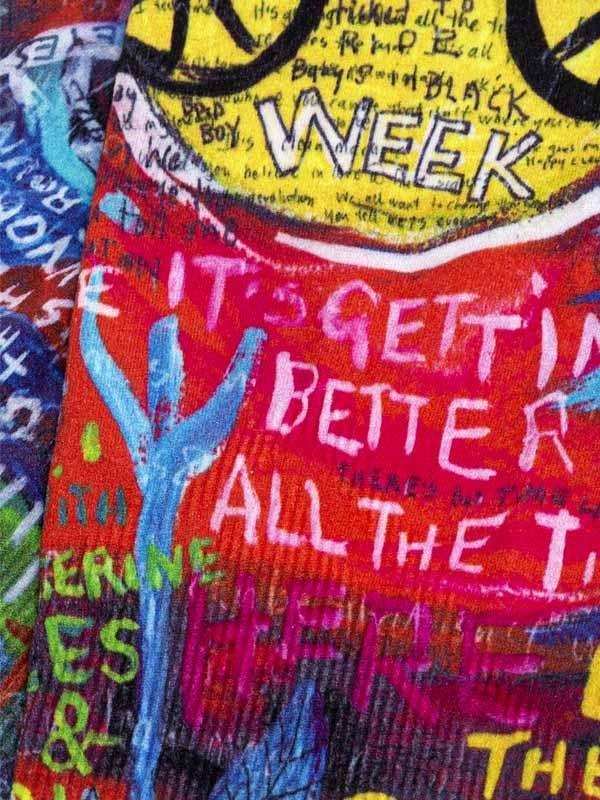 Vibrant cycling jersey with bold graffiti-style text and colorful graphics, ideal for men's and women's bike wear.