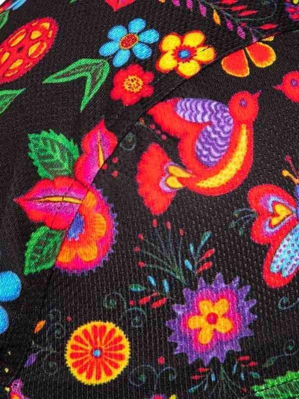 Vibrant floral and bird print on black cycling fabric, colorful design for women's or men's apparel
