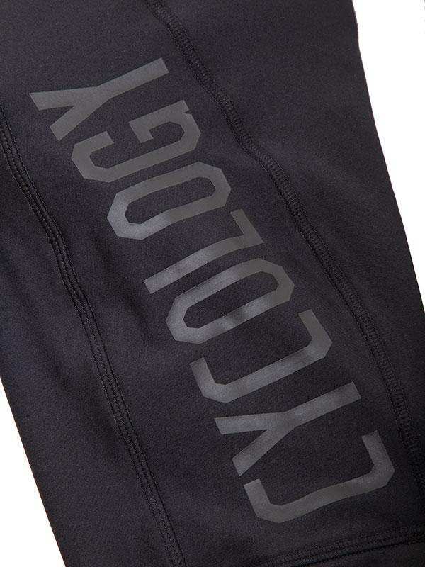 Black cycling legging with bold 'CYCOLOGY' branding, high-performance fabric for men's and women's rides