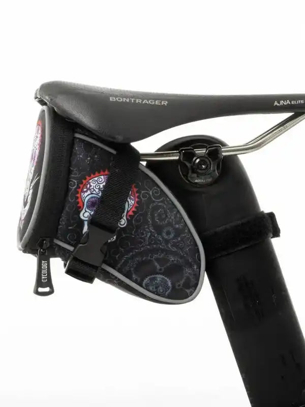 Cycology saddle bag with sugar skull design, attached to Bontrager bike seat for cycling storage