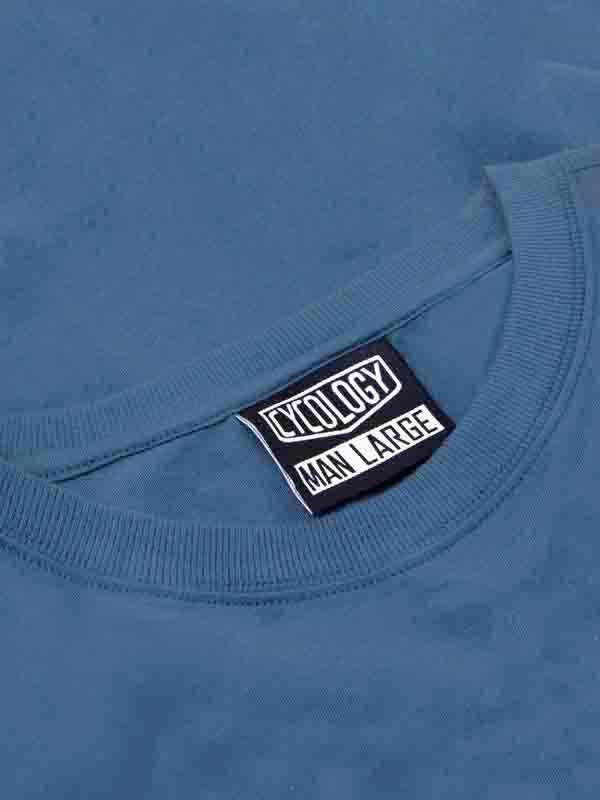 Blue men's cycling t-shirt with 'CYCOLOGY MAN LARGE' neck tag, soft fabric detail