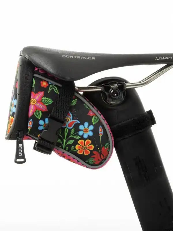 Colorful floral bike saddle bag attached to Bontrager seat, ideal for cycling storage