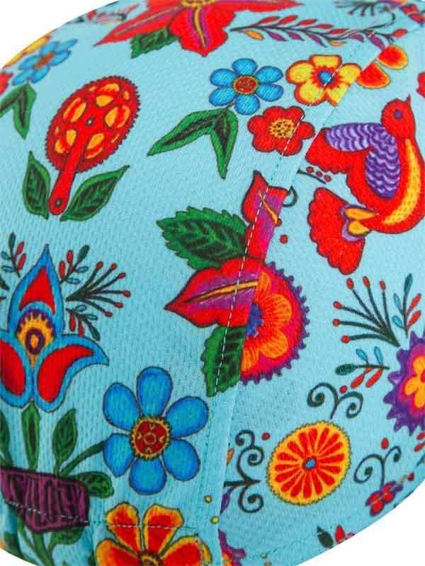 Vibrant floral and bird print on light blue cycling fabric, colorful design for women's or men's apparel