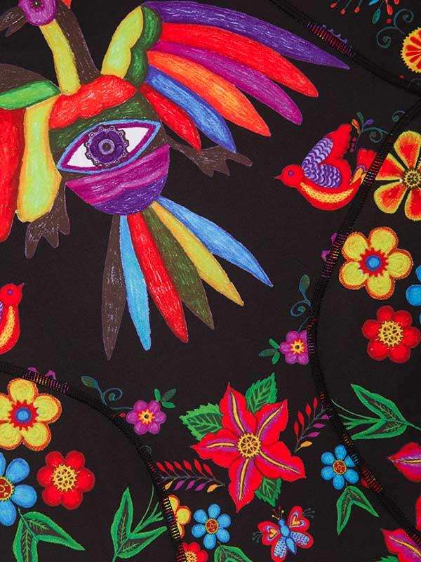 Vibrant floral and bird print cycling jersey with bold colors and artistic eye design on black fabric