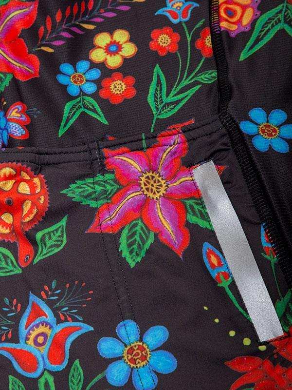 Vibrant floral print cycling jersey with reflective strip, colorful flowers on black fabric