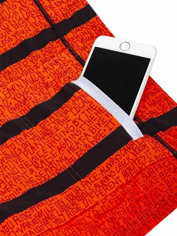 Orange cycling shorts with black stripes and text print, featuring a phone pocket for riders