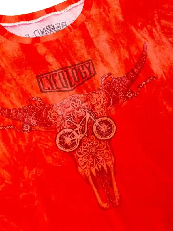 Vibrant red cycling jersey with ornate bull skull and bike graphic, bold 'CYCOLOGY' print
