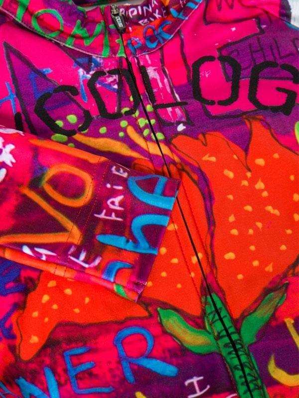 Vibrant graffiti-style cycling jersey with bold colors and urban art design for men and women.