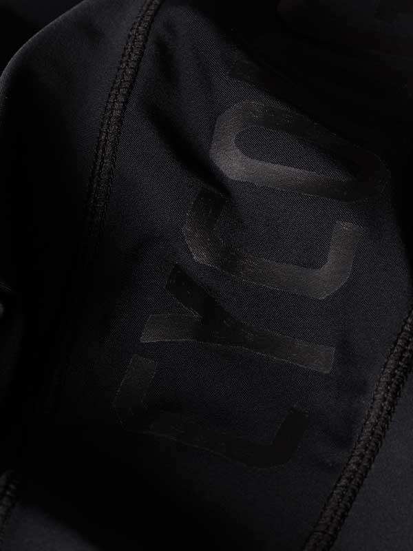 Black cycling jersey with subtle 'CYC' logo, high-quality fabric detail