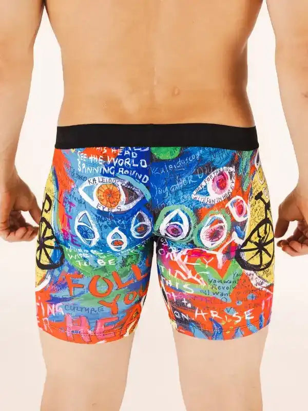 Men's colorful cycling shorts with artistic graffiti design, bold text, and bike motifs for active wear
