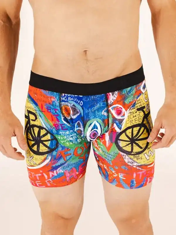 Men's colorful cycling shorts with graffiti-style bike graphics and bold text design