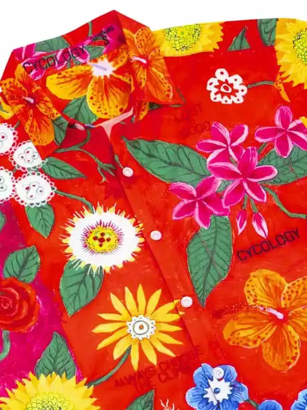 Vibrant red cycling shirt with tropical floral print, featuring hibiscus and sunflowers for women's and men's bike wear.