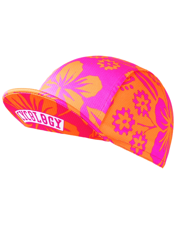 Colorful pink and orange cycling cap with floral pattern and 'Cycology' branding on peak