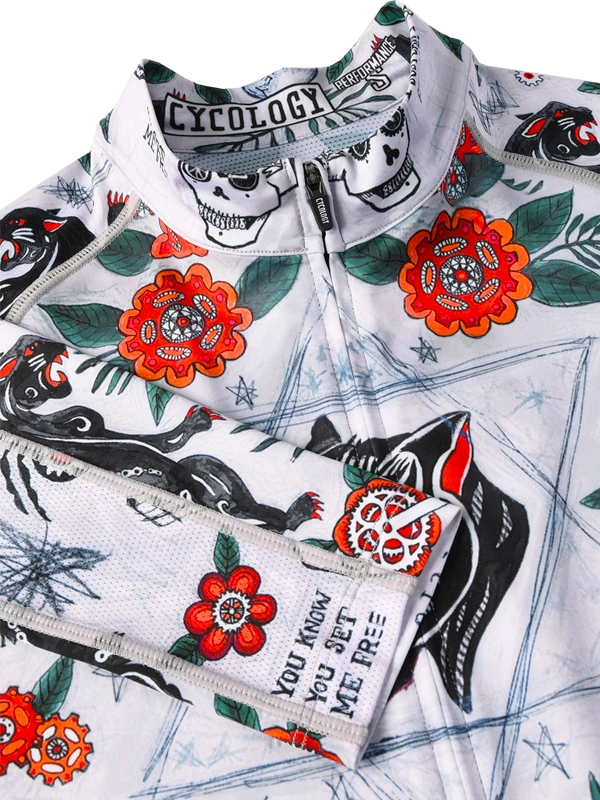 Long-sleeve cycling jersey with floral and panther design on a grey background