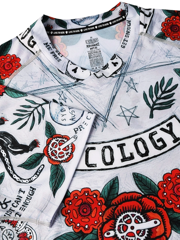 Short-sleeve MTB Jersey with floral and panther design on a light grey background, featuring the brand 'Cycology'.