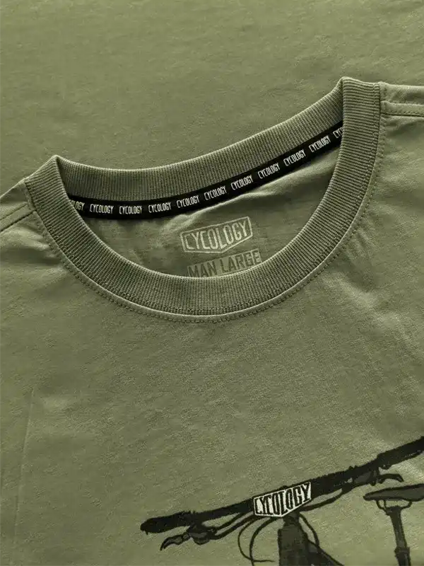 Olive green cycling t-shirt with bike graphic, ribbed collar, and branded tag detail for men's active wear