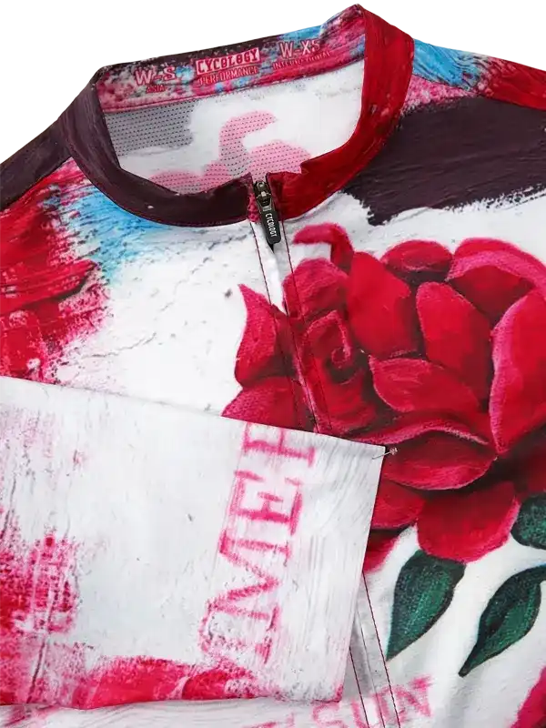 Women's cycling jersey with bold red rose print, mesh collar, and front zipper for performance rides.