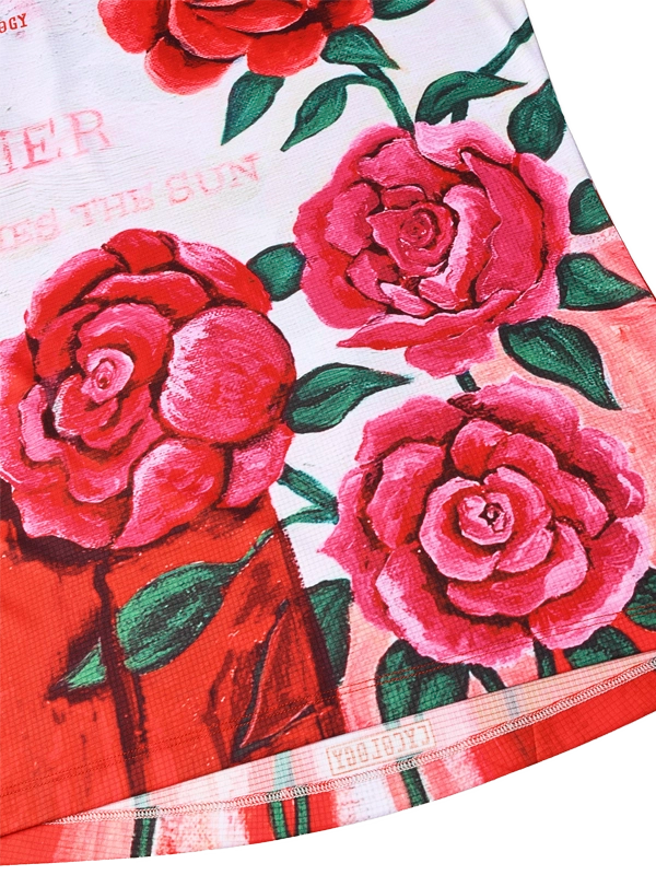 Fabric with red and pink roses and green leaves on a white background