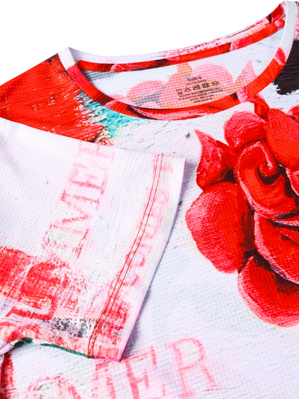 Close-up of a Technical  women's T-shirt with red and pink rose design on a white background