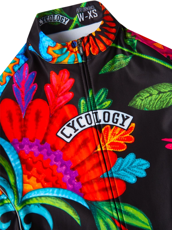 Colorful cycling jersey with Cycology branding and floral design