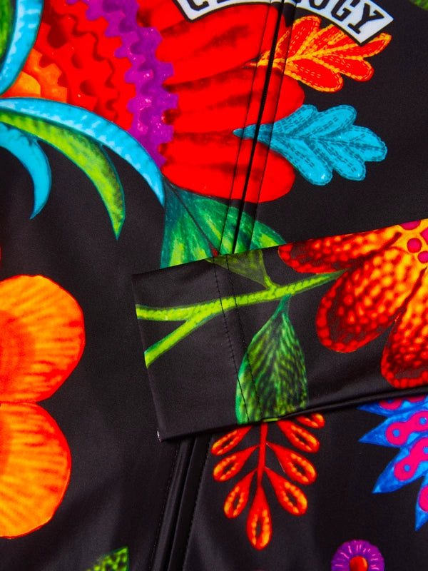Colorful floral-patterned long sleeve cycling jersey on a black background