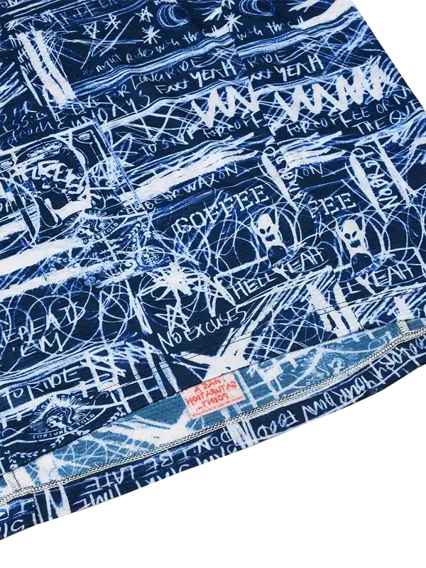 Men's cycling jersey with bold white graffiti-style graphics on navy blue, featuring phrases like 'COFFEE' and 'NO EXCUSES'