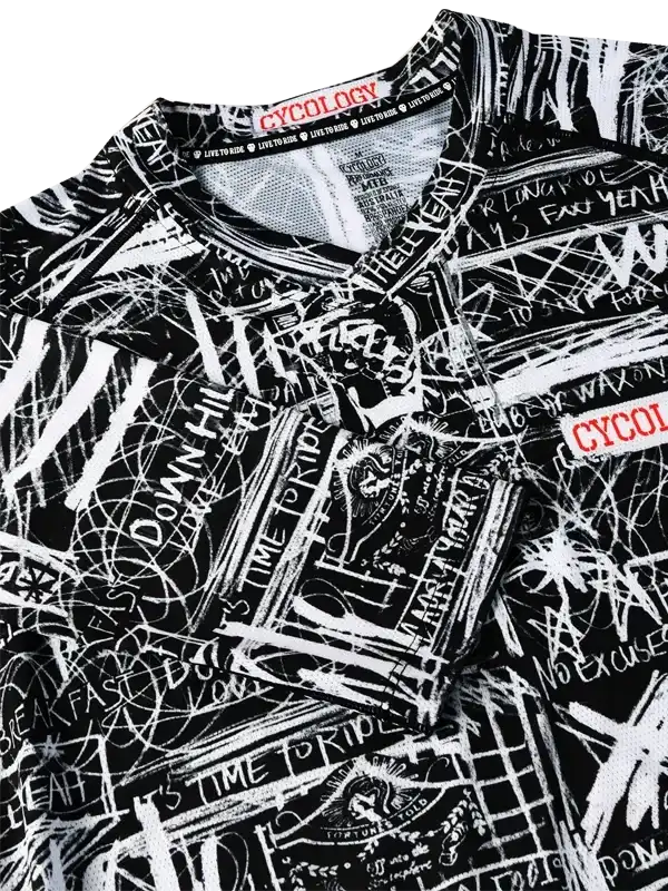 Black and white graffiti-style cycling jersey with bold text and graphics, featuring 'CYCOLOGY' tag