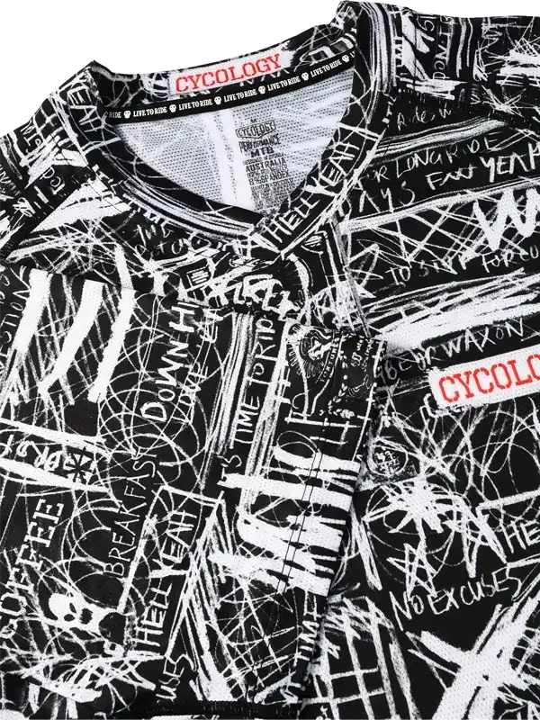 Black and white graffiti-style cycling jersey with bold text print, featuring 'No Excuses' and 'Live to Ride' slogans.
