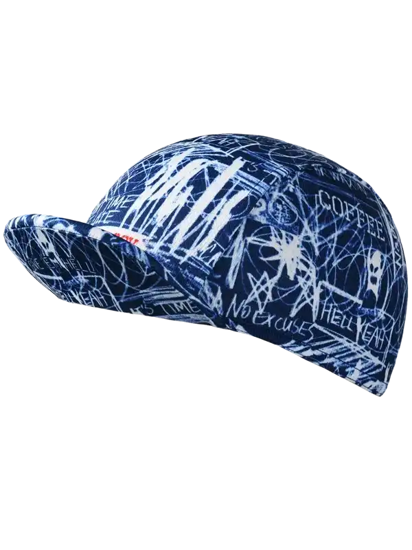 Blue cycling cap with white graffiti-style print, featuring 'No Excuses' and 'Coffee' text for bike rides.