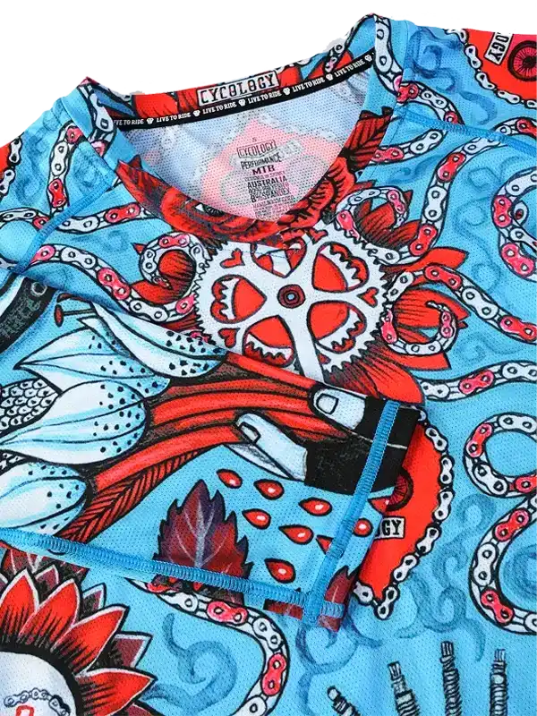 Vibrant blue cycling jersey with red octopus and gear design, ideal for men and women riders.