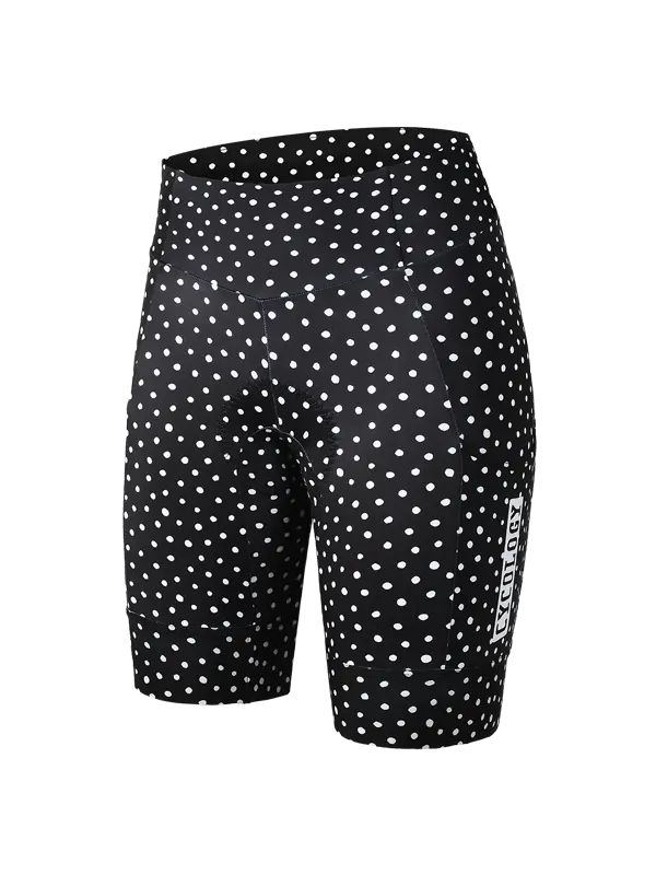 Women's black cycling cargo shorts with a white polka dot pattern and a vertical white CYCOLOGY logo on the lower left leg, shown against a plain white background.