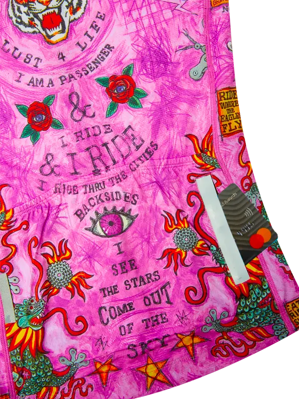 Pink fabric with colorful graphics and text 