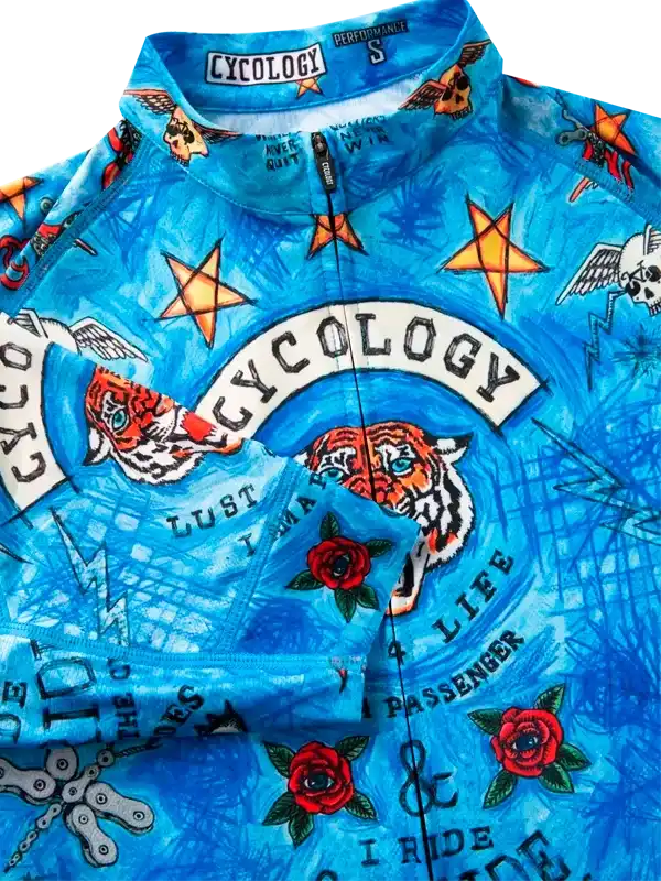 Blue cycling jersey with tiger, roses, stars, and 'Cycology' print for men's and women's bike rides