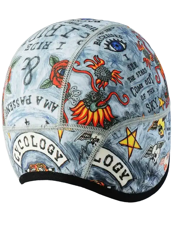 Cycling cap with vibrant tattoo-style designs, featuring roses, stars, and bold text for unique road ride style.