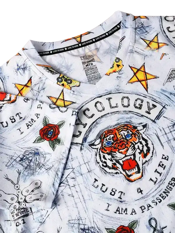 White cycling jersey with tiger graphic, stars, roses, and 'Cycology' text, featuring bold street-art style design.