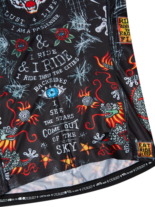 Close up of black cycling jersey with colorful graphics and text, featuring a tiger and various designs.