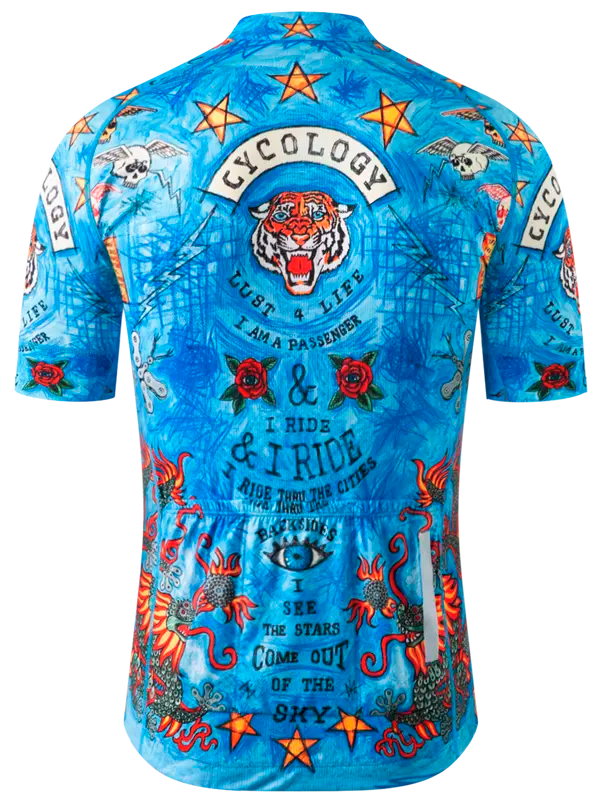 Blue cycling jersey with colorful graphic design with dragons, stars, and text and Cycology brand