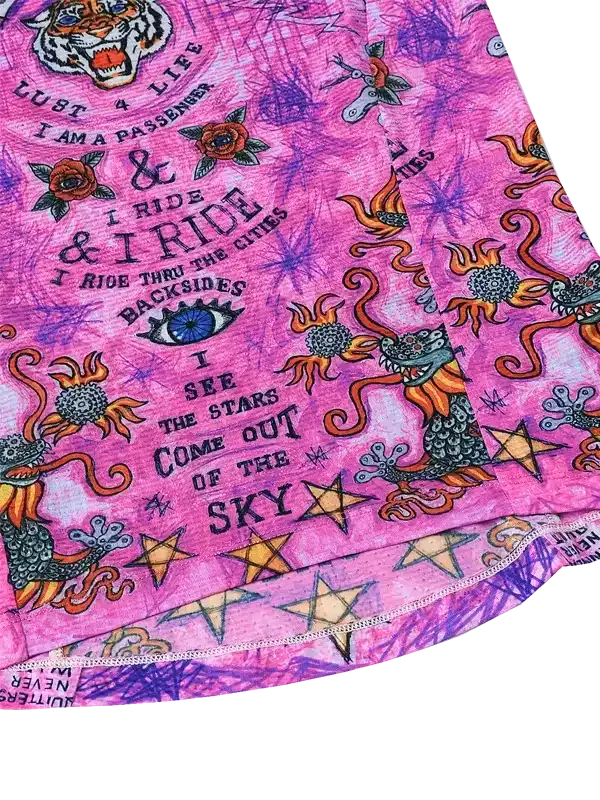 Vibrant pink cycling jersey with dragon, stars, and bold text design for women's bike wear
