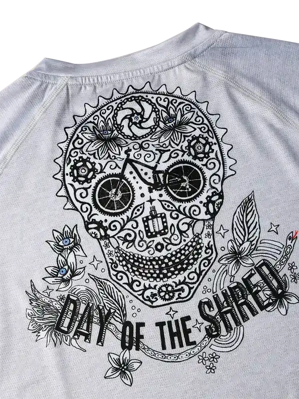 Men's cycling jersey with sugar skull 'Day of the Shred' graphic, floral and bike gear details
