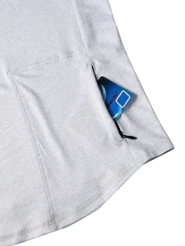 White cycling jersey with zippered pocket holding a blue card, ideal for on-the-go storage during rides.