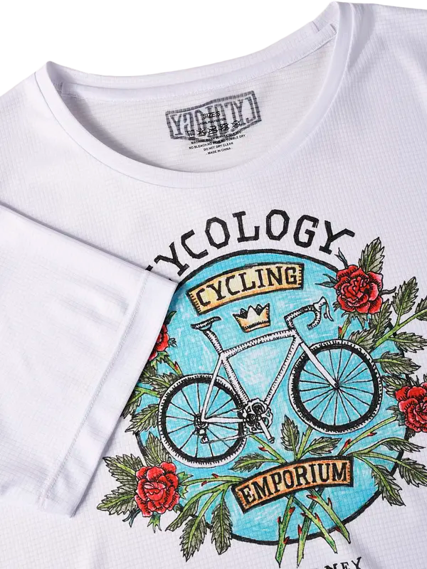 White t-shirt with a bicycle and floral design on a white background